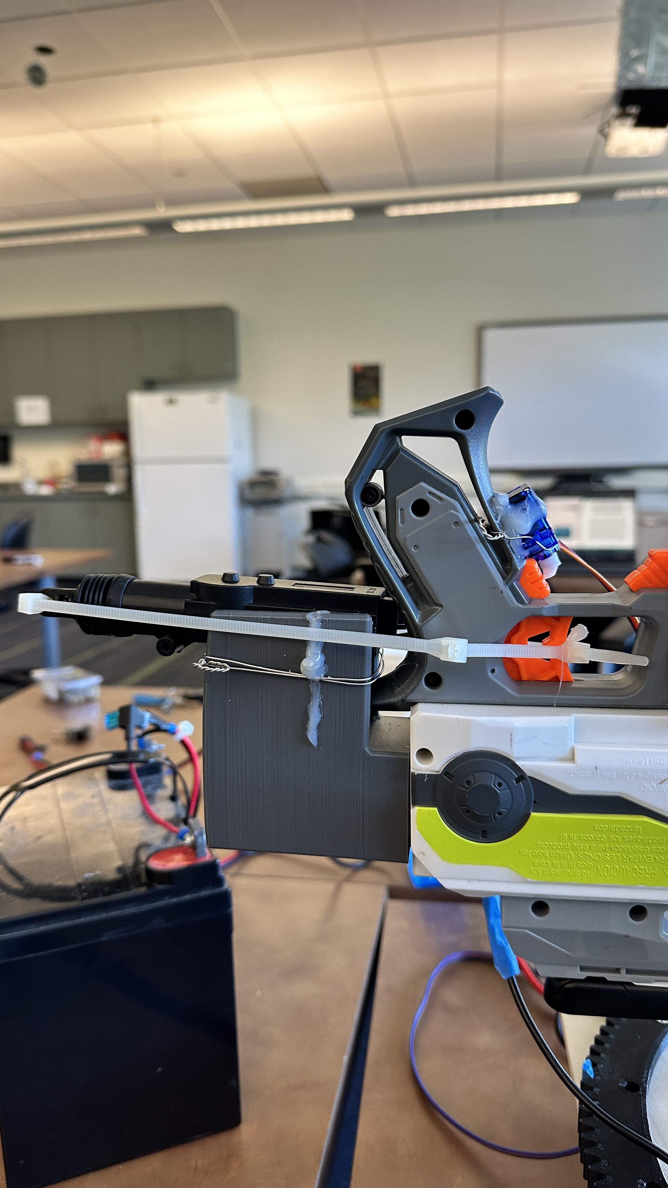 Automotive actuator and zip-tie trigger linkage on GORDON's Nerf blaster